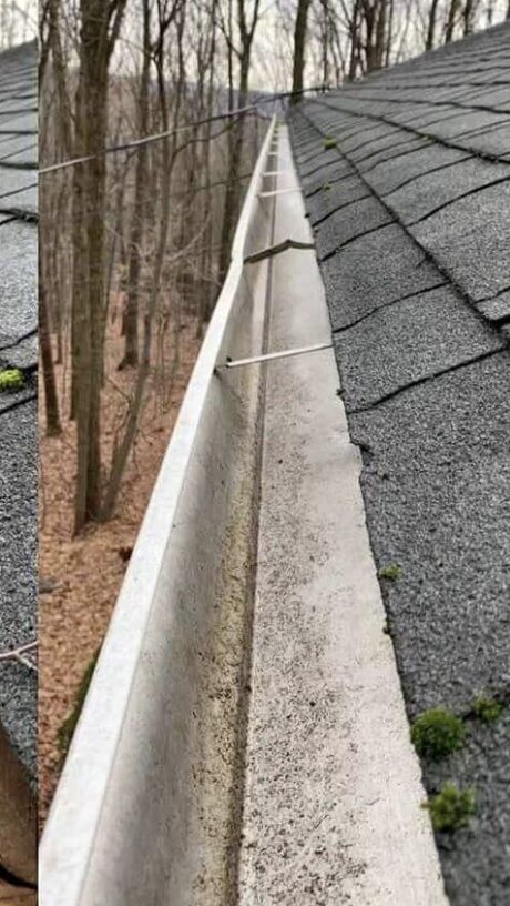 The same gutter run cleared and rinsed