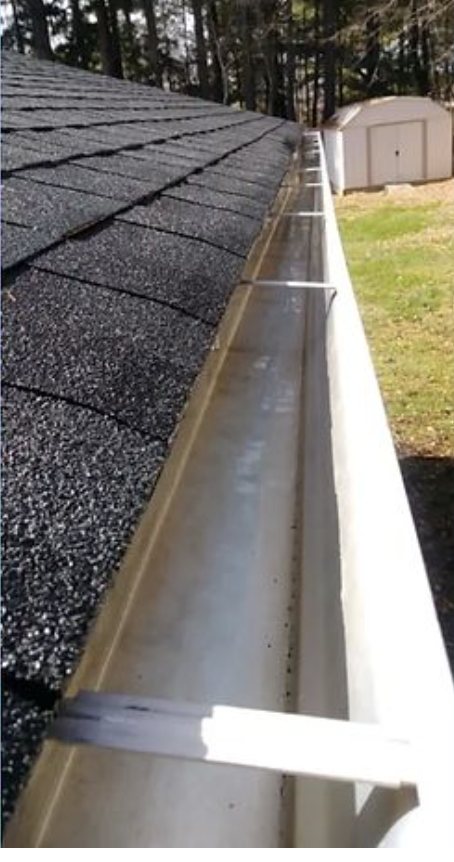 The same gutter run cleared and rinsed