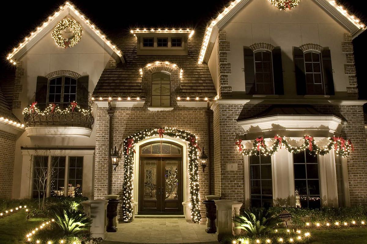 Roofline and entrance lighting on a residential property at night