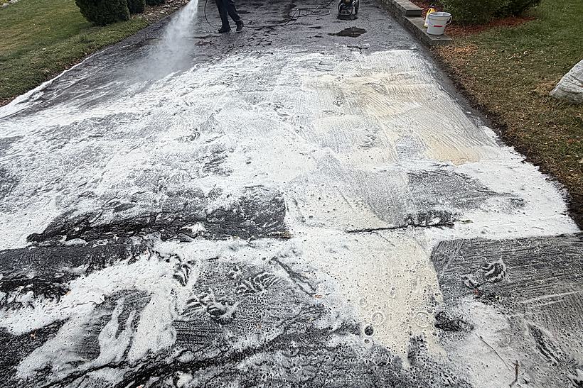 Driveway covered in detergent during a pressure wash